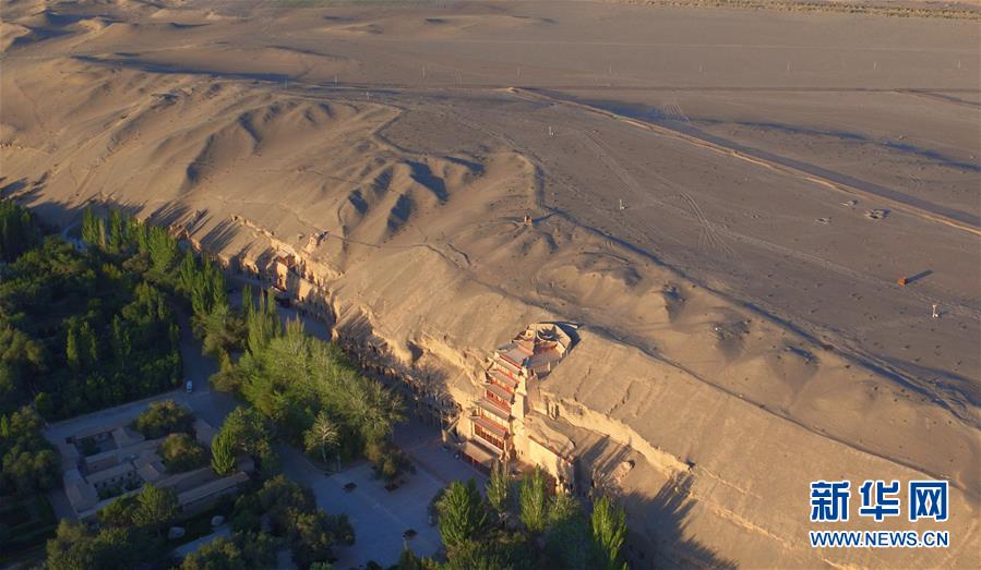 (時代先鋒·圖文互動)(12)此生不悔入沙海 勇擔重任始見金——敦煌研究院文物保護利用群體群像
